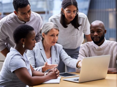 group of employees discussing cyber insurance requirements