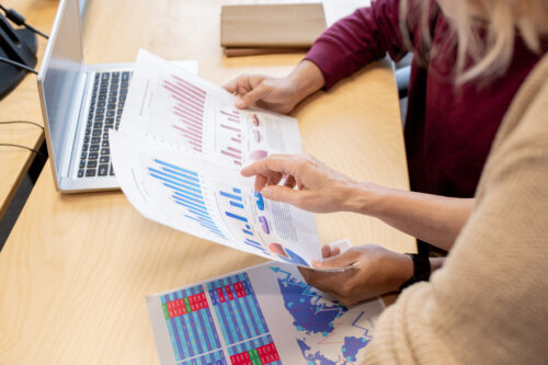 Business employees analyzing graphs